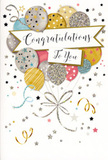 The congratulations card displayed here resembles a delicate celebration drifting in mid-air, like balloons seen above Hammersmith Bridge on a clear, breezy day. At the centre, an abundant cluster of illustrated balloons rises together, their rounded shapes forming a cohesive, almost bouquet-like arrangement. Each balloon features a soft, contemporary colour: muted gold, brushed silver, champagne, soft blue, blush pink, and light grey. Many are embellished with tiny, sparkling stars, slim stripes, and scattered glitter-like dots that suggest subtle metallic foil details that would feel smooth and slightly raised under your fingertips. From their bases, slender ribbons in shimmering gold and silver trail down in relaxed curls, overlapping and winding across the lower portion of the card the way a florist might let ribbon fall naturally from a gift-wrapped bouquet. Cutting through the centre of the balloons is a generous banner, gently arched and rendered in a complementary neutral tone. On this banner, the phrase Congratulations To You appears in elegant, sweeping calligraphy, lending the card an air of considered, personal appreciation. The background is soft and uncluttered, gently sprinkled with tiny stars, confetti dots, and festive swirls that create the impression of suspended motion, like confetti hanging in the air just after being tossed outside a celebration on King Street. The design balances sophistication with playfulness, making it suitable for many joyful occasions: a new job, a graduation, a house move, or any proud moment being marked with flowers delivered across Hammersmith. The overall mood is one of lightness, pride, and understated glamour, conveying heartfelt congratulations in a beautifully visual way.